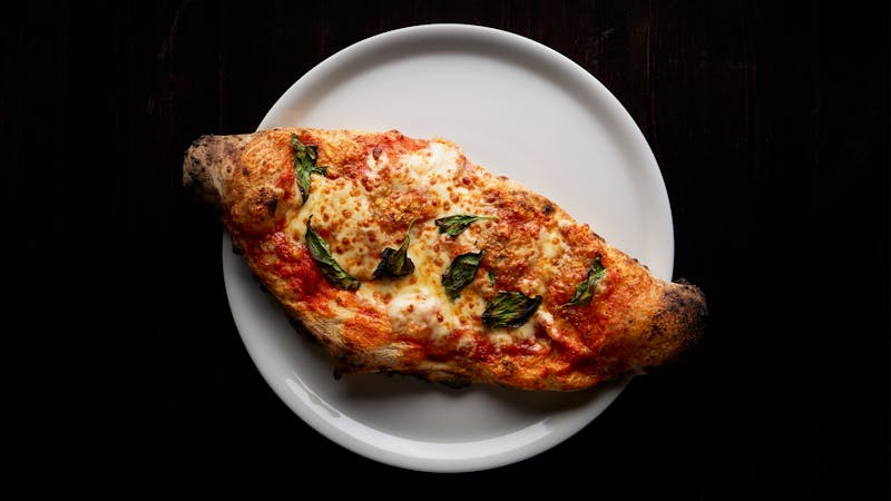 Pizzana Margherita wood-fired pizza with fresh basil and mozzarella