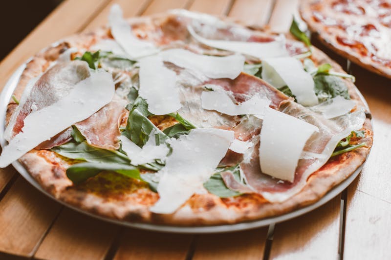 Prosciutto arugula pizza with fig jam from Pizzana
